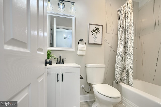 full bathroom featuring vanity, toilet, and shower / bath combo with shower curtain