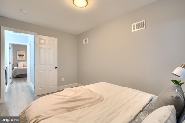 bedroom featuring light hardwood / wood-style floors