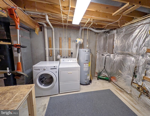 washroom featuring independent washer and dryer and electric water heater