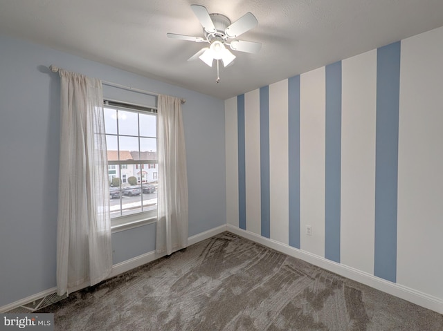 carpeted empty room with ceiling fan