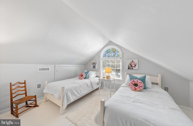 bedroom featuring lofted ceiling