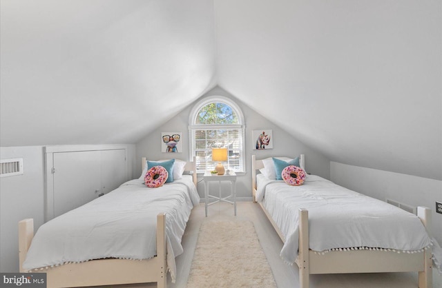 bedroom featuring vaulted ceiling