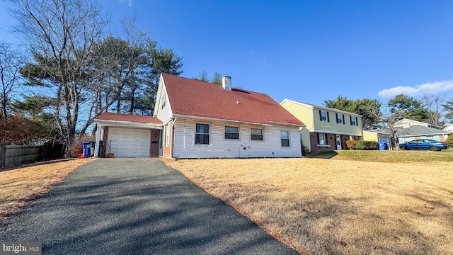 exterior space with a garage and a yard