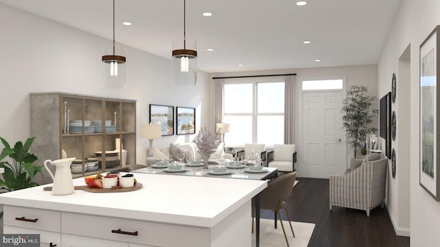 kitchen with decorative light fixtures, white cabinetry, and dark wood-type flooring