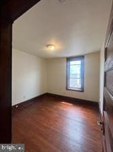 interior space with dark hardwood / wood-style flooring