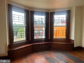 unfurnished dining area featuring hardwood / wood-style flooring