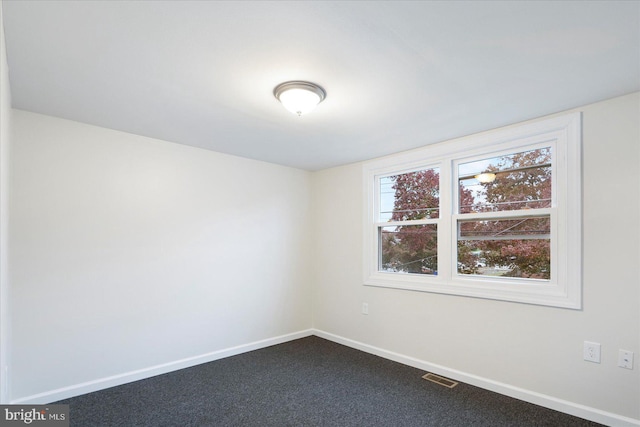 unfurnished room with carpet floors