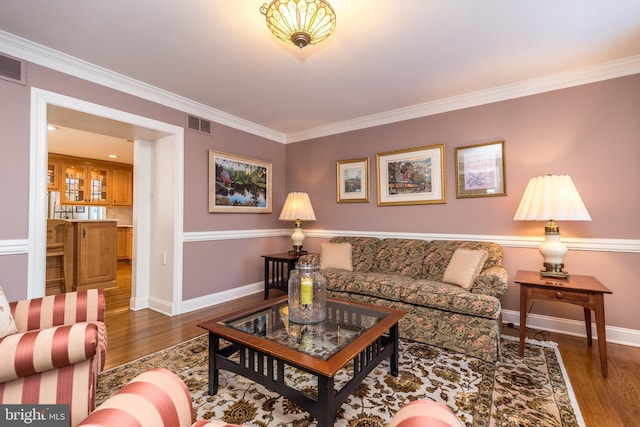 living room featuring crown molding and dark hardwood / wood-style floors