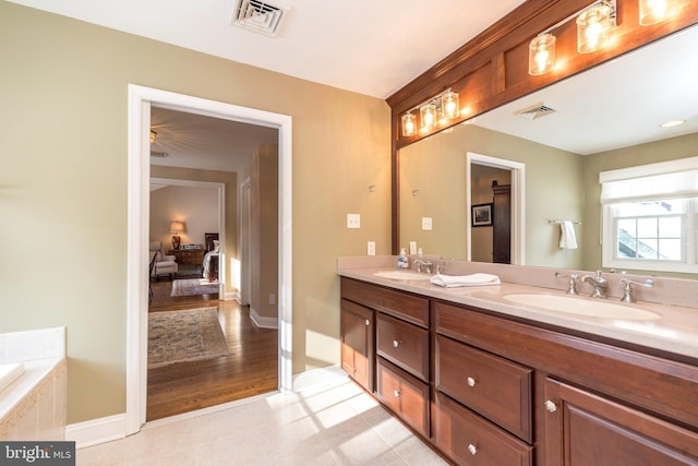 bathroom with vanity and a bathtub