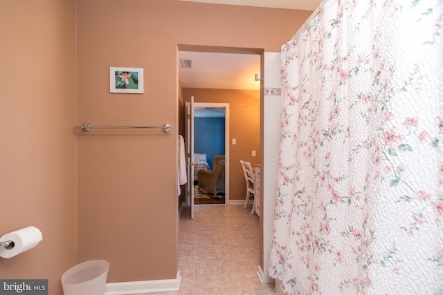 bathroom with tile patterned floors