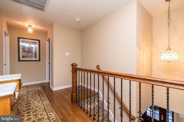 hallway with dark hardwood / wood-style floors