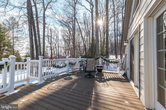 view of snow covered deck