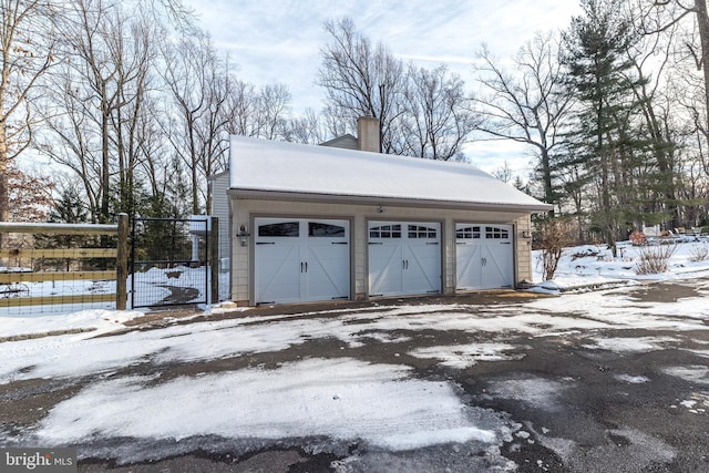 view of snow covered garage