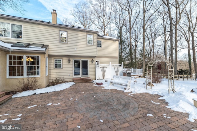 view of snow covered house