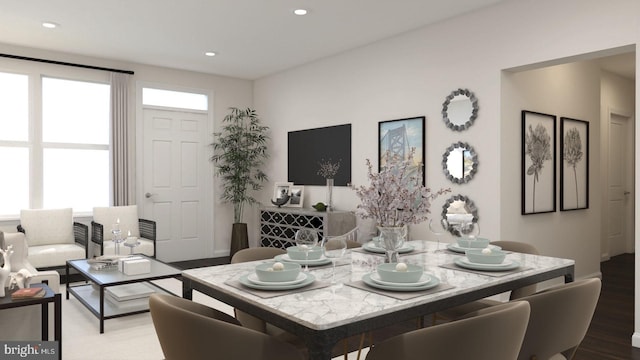 dining area with hardwood / wood-style flooring