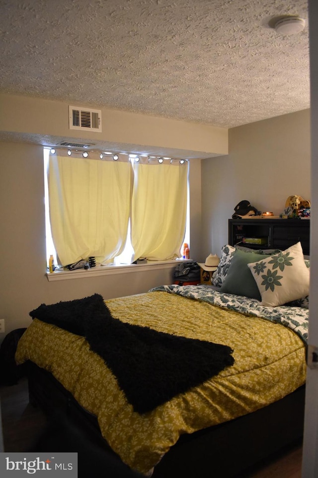 bedroom with a textured ceiling