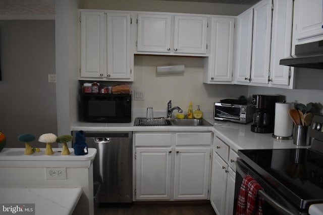 kitchen with stainless steel dishwasher, exhaust hood, sink, electric stove, and white cabinetry