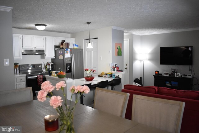 dining area featuring crown molding and a textured ceiling