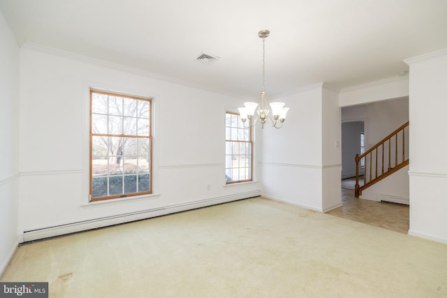 spare room with baseboard heating, a chandelier, and ornamental molding