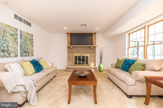 living room with light colored carpet and a brick fireplace