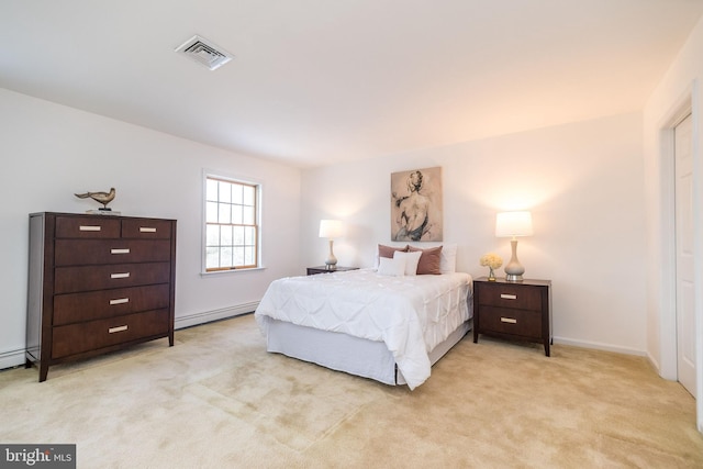 carpeted bedroom with a baseboard heating unit