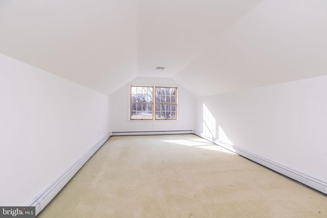 bonus room with light colored carpet, a baseboard radiator, and vaulted ceiling