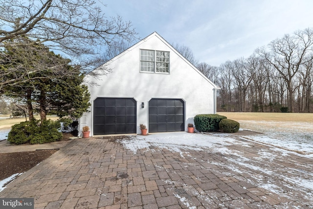 view of property exterior featuring a garage