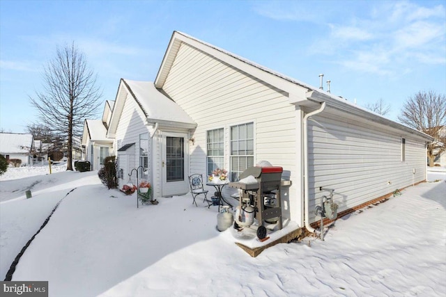 view of snow covered house