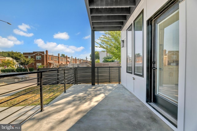 view of patio featuring a balcony