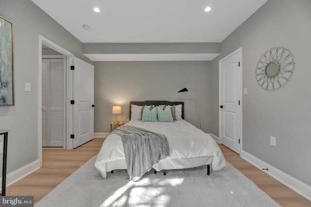 bedroom with light wood-type flooring