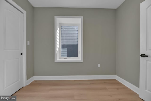 spare room featuring light wood-type flooring