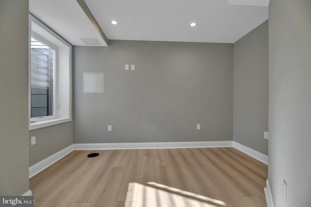 spare room featuring light wood-type flooring