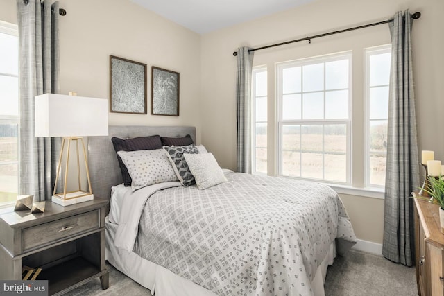 bedroom featuring light carpet