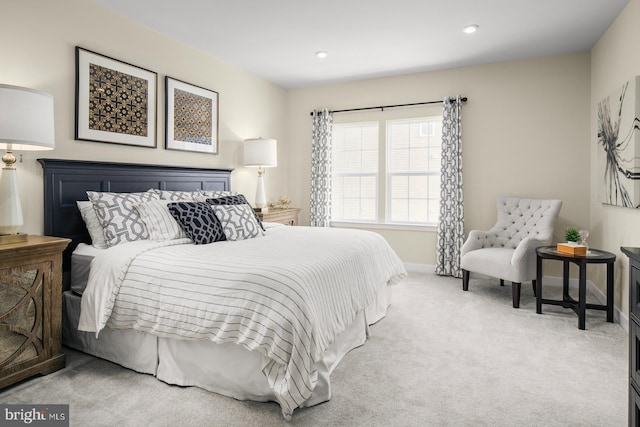 bedroom featuring light colored carpet