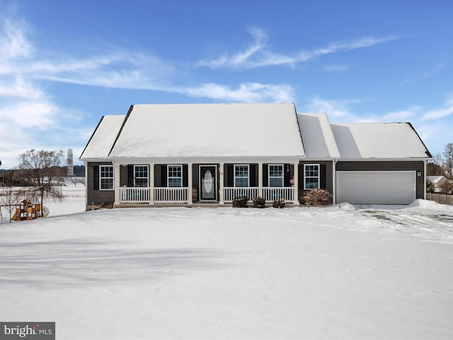 view of front of property featuring a garage and covered porch