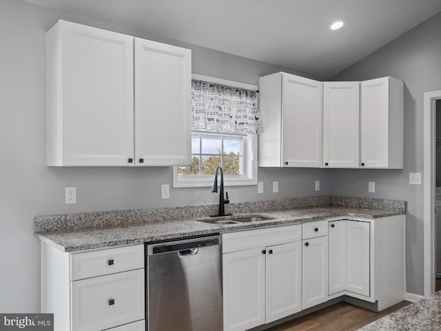 kitchen featuring sink, stainless steel dishwasher, and white cabinets