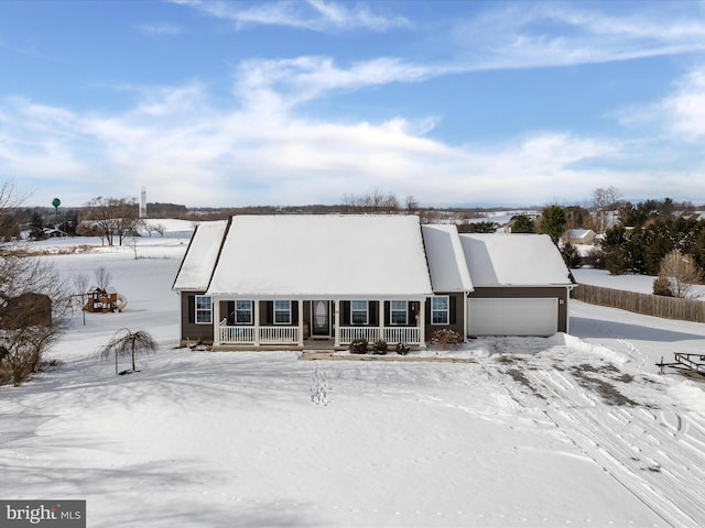 view of front of property featuring a porch and a garage