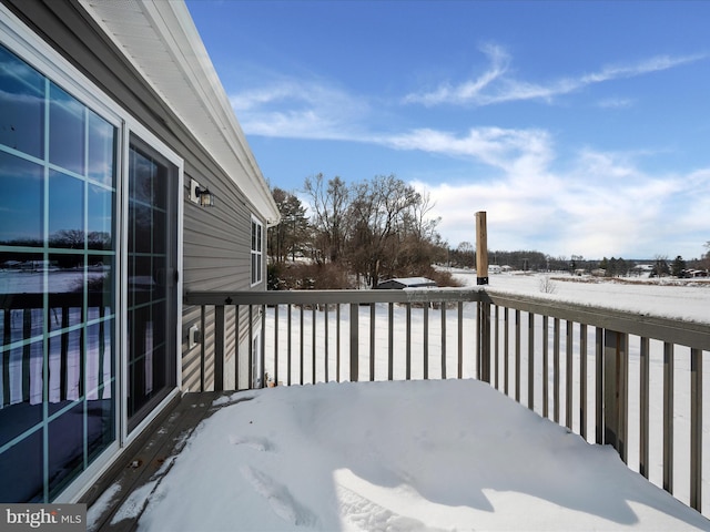 view of snow covered deck