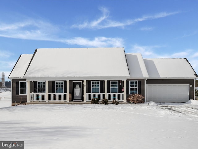 view of front of house with a garage and a porch