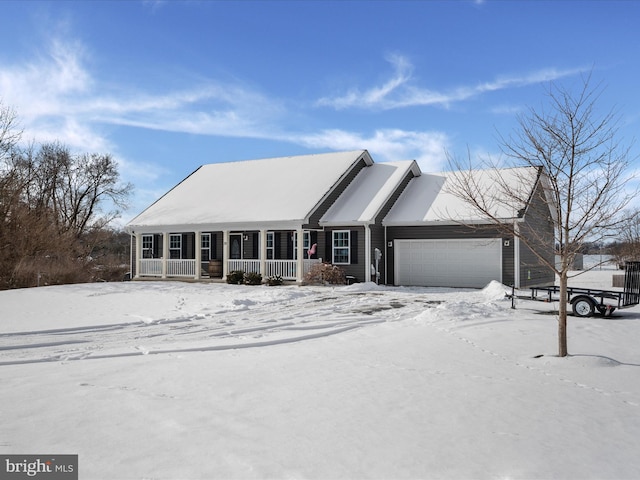 view of front of house featuring a garage and covered porch