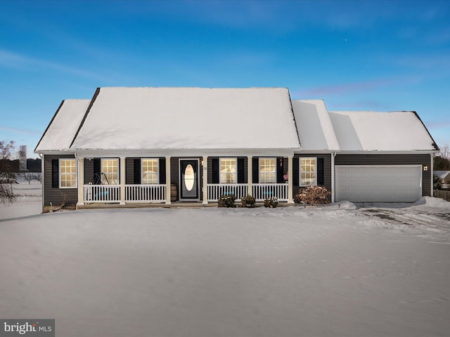 view of front of house with a garage and a porch