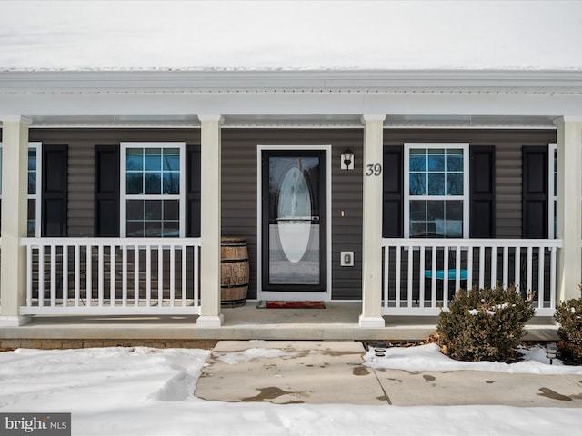 view of snow covered property entrance