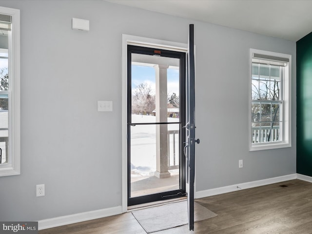 entryway with hardwood / wood-style flooring