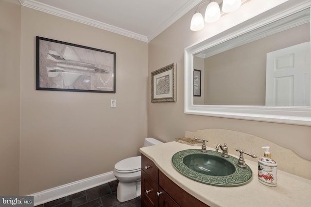 bathroom with toilet, vanity, ornamental molding, and tile patterned flooring