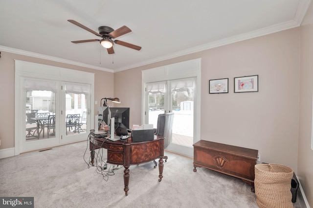 carpeted office space with ceiling fan, french doors, a wealth of natural light, and crown molding