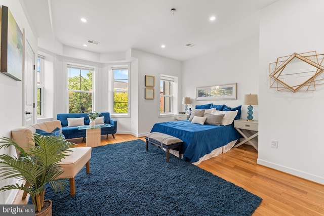 bedroom with hardwood / wood-style flooring