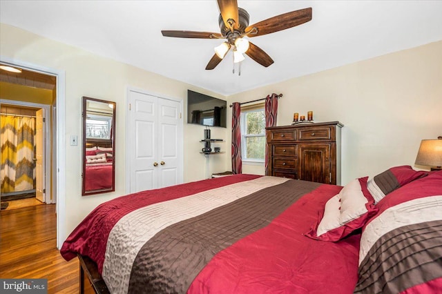 bedroom with a ceiling fan and wood finished floors