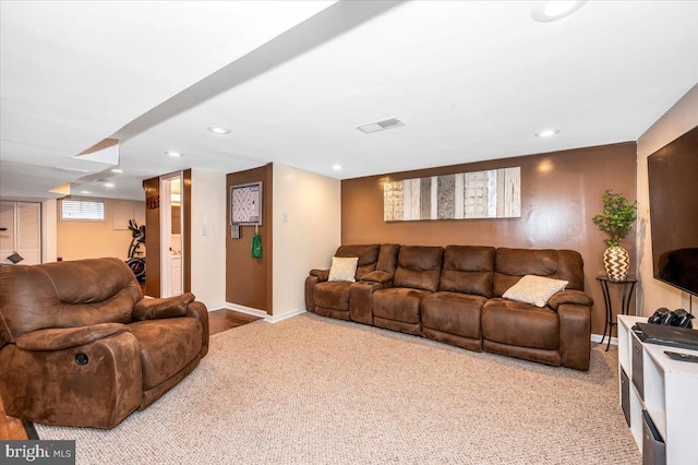 living area featuring light carpet, recessed lighting, visible vents, and baseboards