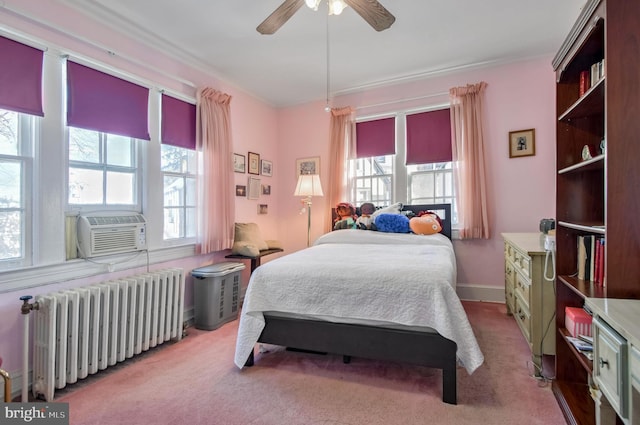 carpeted bedroom featuring radiator, cooling unit, and ceiling fan