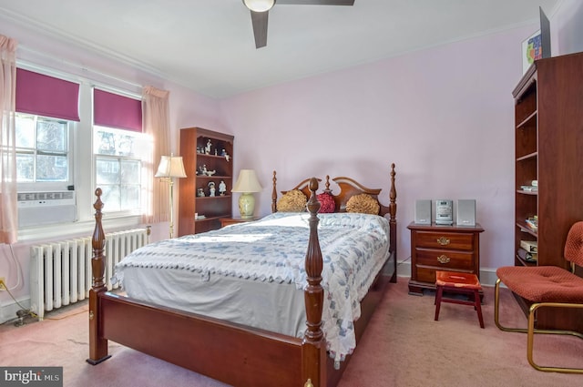 carpeted bedroom featuring ceiling fan, cooling unit, and radiator